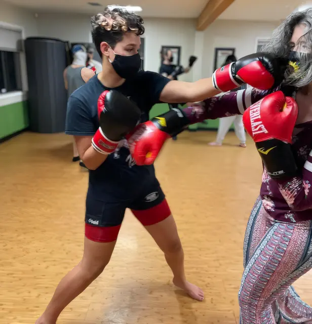 Photo of two River City Warrior Female Students Sparring