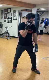 coach joe heller teaching proper punch blocking technique at River City Warriors